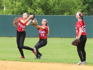 Maddie Napoli (25) and Sam Stone (13) chase the same popup
