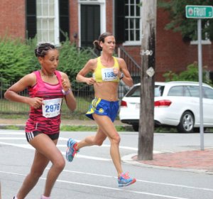 Second place finisher Aregash Abate (2976) and Katie Misuraca (1595) together after a mile