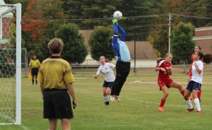 GNG goalie Zoe Adams jumps for a save