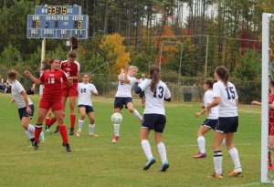 Emma Woods (8) nods in the first Patriots goal