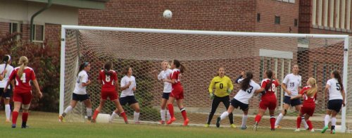 Maria Valente (18) in position to head in a goal