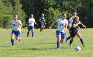 Devynn Turner (#22) tries to beat Maddie Amidon to the ball