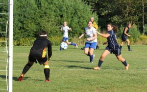 Taylor Bando gets in for a shot