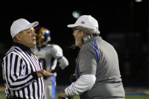 BHS coach Rich Angarano questions the roughing the kicker call