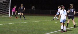 Caitlyn Winn shoots the 7th Windham goal