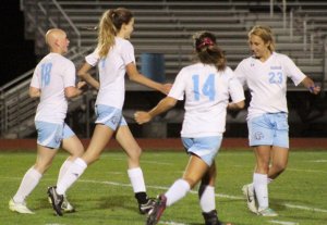 Jenna Soucy (3 goals) congratulates Caitlyn Winn after she scored the 7th Windham goal