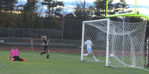 Ciera Berthiaume slides by the Marshwood goal after scoring in the first twenty seconds.