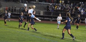 Melissa Morton (9) goes high to head