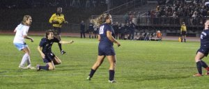 Jenna Soucy watches her shot sail into the net