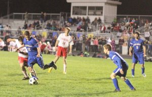 Kolin Wyman (12) clears the ball away for Lake Region