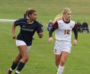 Sophomore Olivia Pena keeps a close eye on 40-goal scorer Caroline Soucy