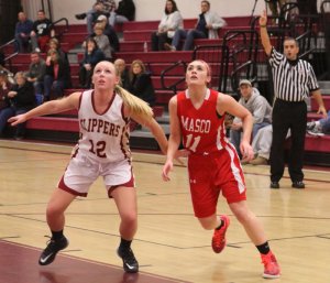 Morgan Johnston and Lauren Sorel (13 points) look for a rebound