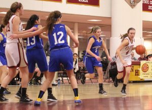 Michaela Corvi drives on Nicole Hogan