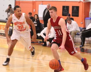 John Philpott drives past James Aaron