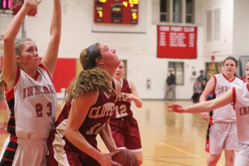 McKenzie Cloutier (12 points) readies a block attempt against Emily Pettigrew (13 points)