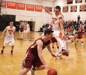 Pat Flaherty (#15) flies at Dan Baribeault