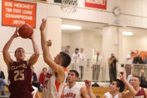 Liam Hundertmark (12 points) gets off a shot