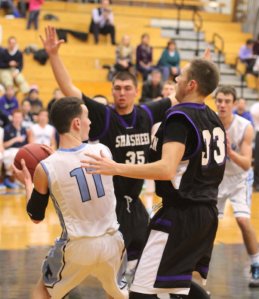 Nick Venora surrounded by Ryan Donnell (35) and Connor Macloud (33)