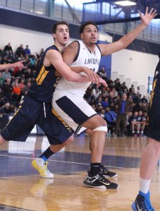 Connor Merinder (29 points) defends 6-9 Franziel Reyes