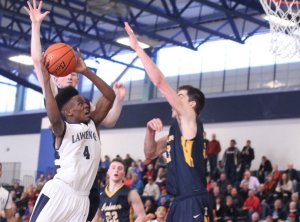 Dontae Neal (19 points) shoots in traffic