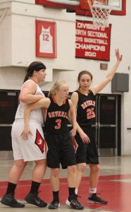 Beverly tries to keep the ball away from 1000-point scorer Jackie Panneton 