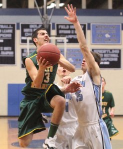 Derek Hogan (18 points) drives