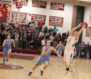 Liam Hundertmark reaches for a high pass