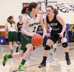 Marie Gaffney (11 points) defends