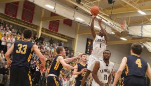 Isaiah McLeod soars above the Andover defense getting sixteen points in the first quarter