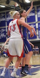 Tara Burke crowds Meg Knollmeyer (11 points)