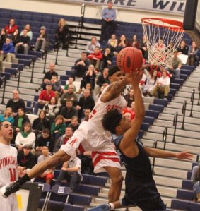 Drew Green goes for the block on Brandon Rodriguez