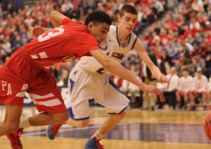 Geo Baker and Jake Coleman chase a loose ball