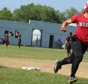 CF Rachel Haselgard about to save a run with a terrific catch