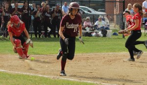 Catcher Caity Baker comes out after a bunt