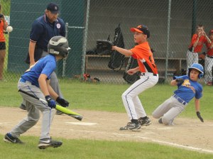 Jake Miceli slides while Ryan Taylor awaits throw