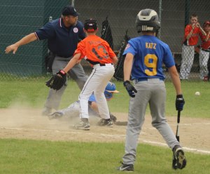 ball gets away from pitcher Ryan Taylor and goes out-of-bounds