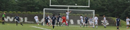 Justin D'Orlando (21) skies to clear corner kick