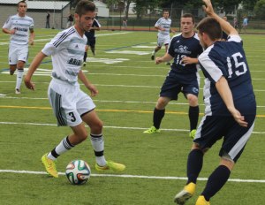 Justin Kingdon puts a move on Jacob Coffey