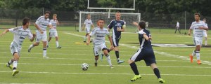 Noah Medeiros (4) looks to pass