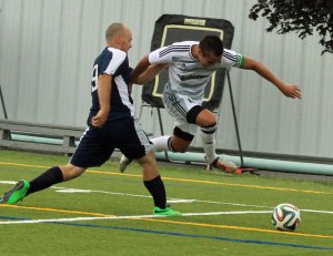 Noah Medeiros leaps to get by SMCC defender Jacob Cavacas