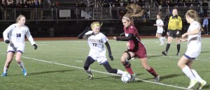 Alicia Calcagni (17) defends Katherine Hostage (8)