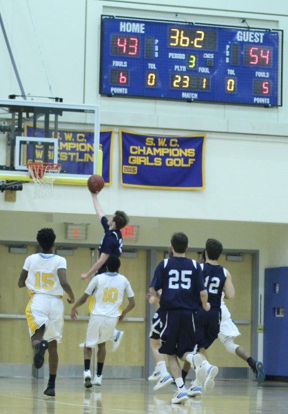 Jack Williams (21 points) gets two during Wilton's second-half, seventeen-point run.