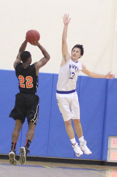 Dillon Palumbo tries for a block on Steffan Harding
