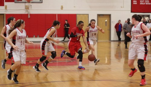 Rae Miles-Willis guarded by the entire Amesbury team