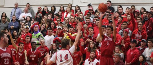 Dan Bertrand (12 points) shoots from in front of the Saugus bench and crowd