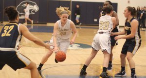 Colleen Corcoran uses an Ellen Fantozzi screen to drive to the basket