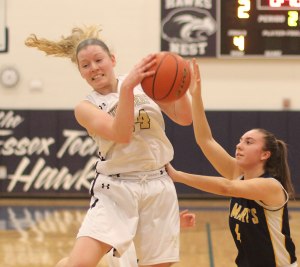 Colleen Corcoran gets one of her eleven rebounds
