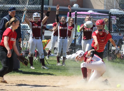 Teammates celebrate Catherine Kingman's HR in the sixth inning