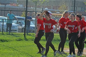 Caity Baker (13) celebrates her sixth-inning home run