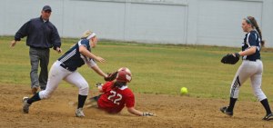 Megan Reid jars the ball loose at second